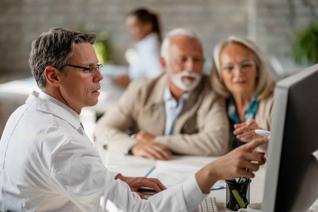 A group of people discussing 5 trends in health insurance.