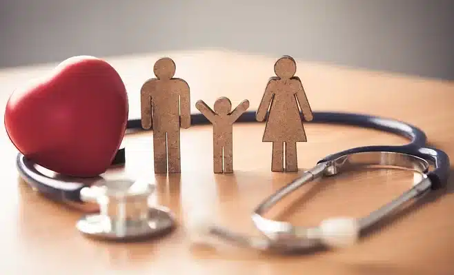 Family health concept with stethoscope and heart.