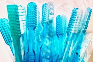 Blue toothbrushes representing dental insurance